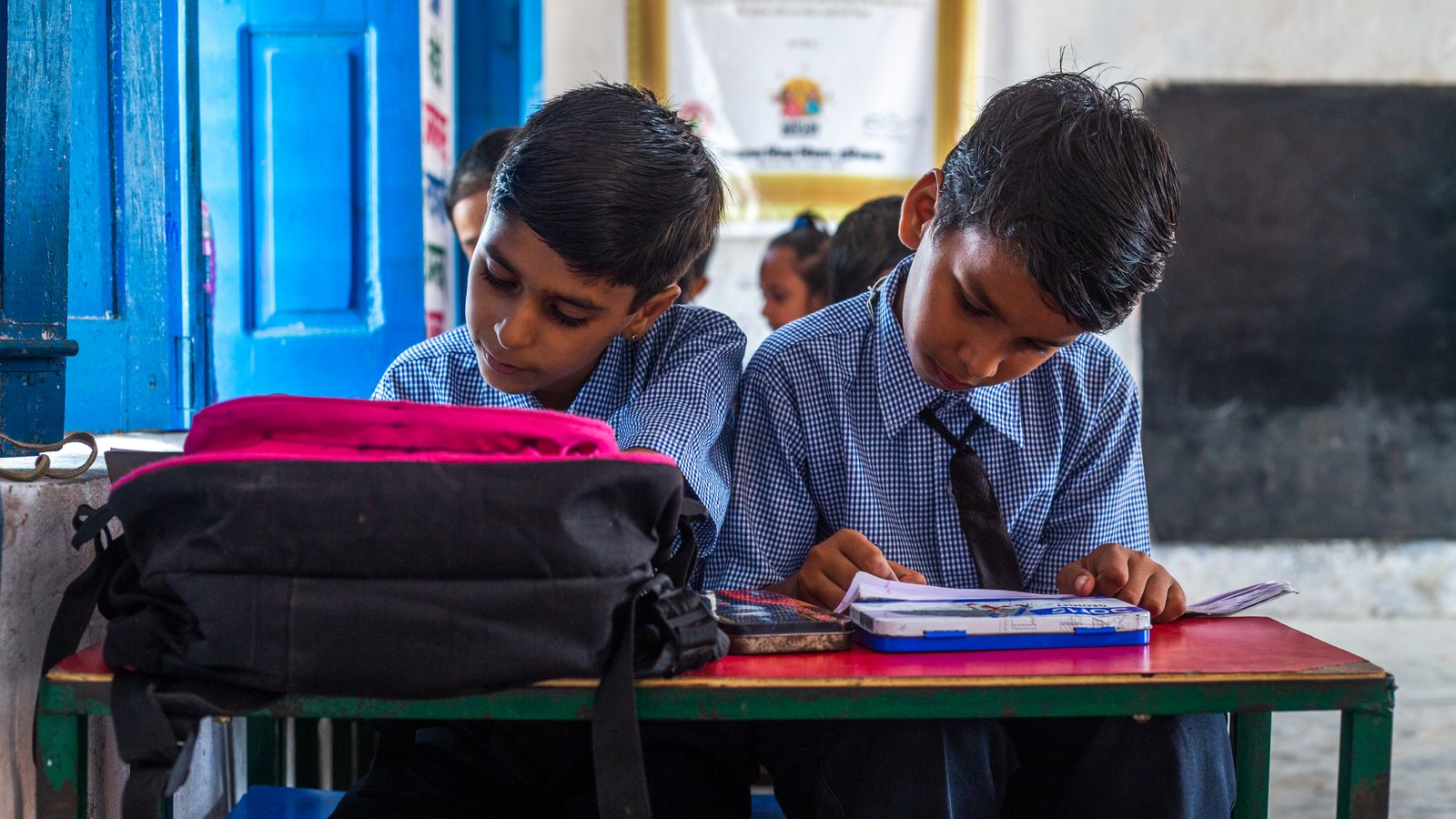 Schoolchildren in Karnataka studying in class